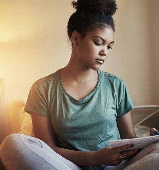 Student writing in a journal