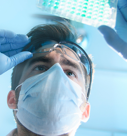Photo of scientist conducting an experiment